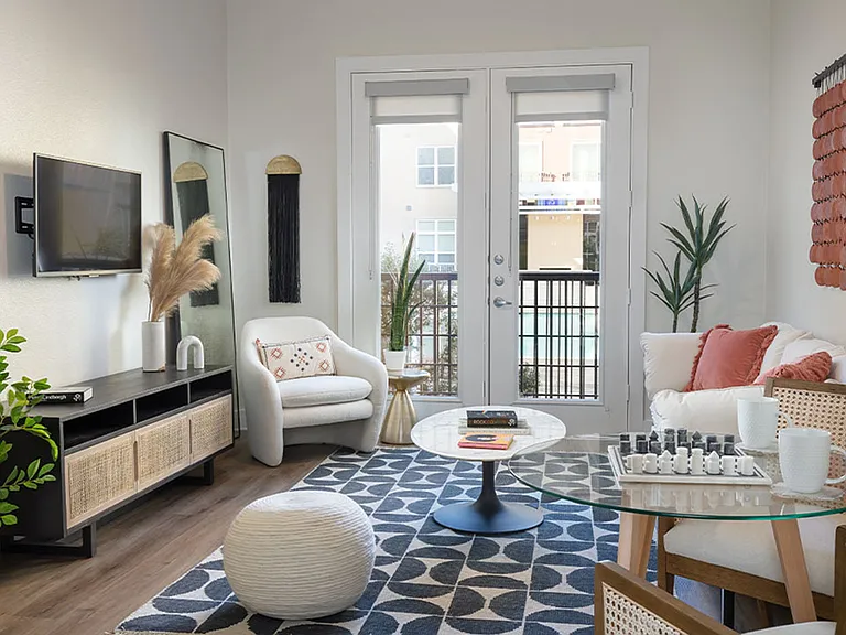 Apartment living room with wood-style flooring.