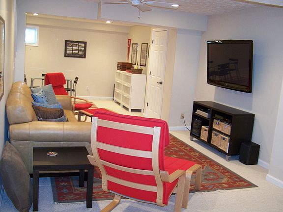 Movie/game area in the finished basement with anchored 50 inch plasma tv