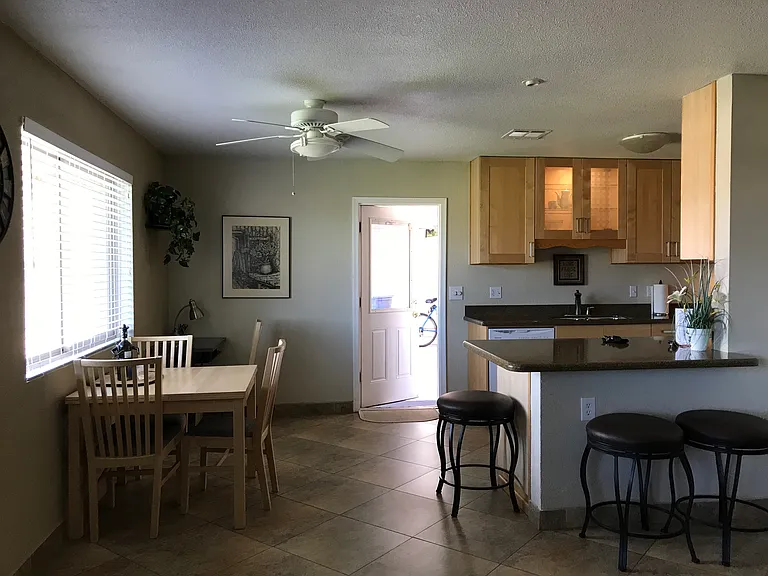 View from living room to dining area and kitchen.