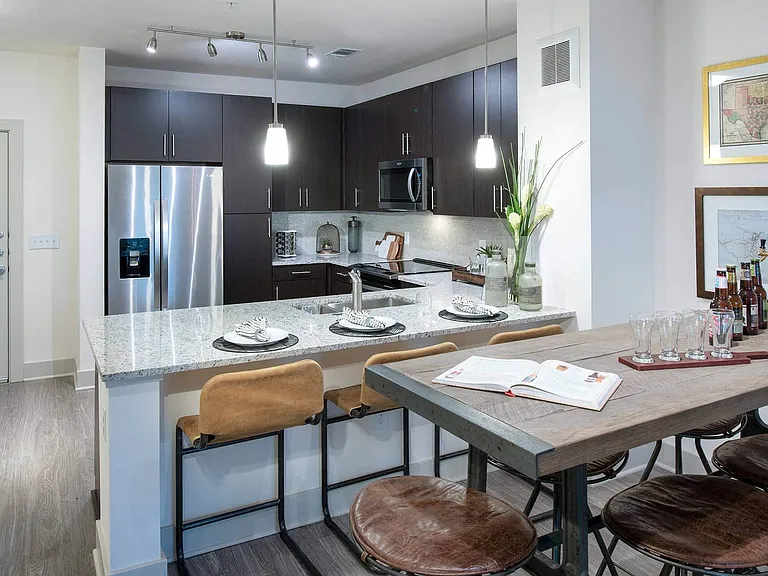 Granite slab and quartz countertops in modern kitchens