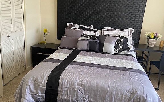 Moderate size bedroom, includes queen size bed, night stand, extra roomy 2 door closet, Television, cble connect with wifi and streaming services, spacious work area, dresser and ottaman