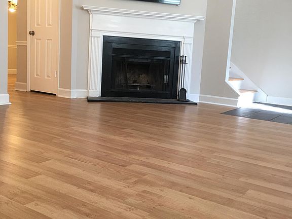 Living room with wood burning fireplace
