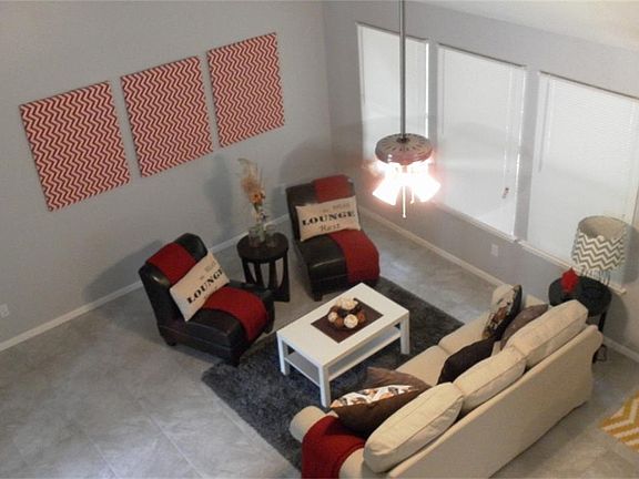 Large spacious den with high ceilings and tile floors