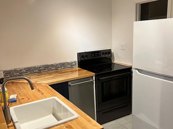 Newly remodeled kitchen with new overhead lighting. Dish washwasher, disposal, induction range and oven.
