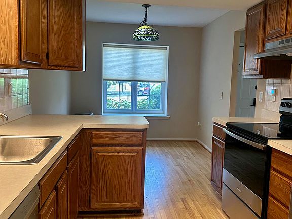 Beautiful eat-in kitchen w/refrigerator, dishwasher, garbage disposer and breakfast nook.