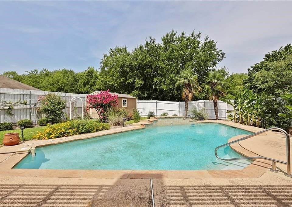 Welcome to your beautiful pool that backs to a greenbelt! Large yard, deck and even a storage shed!