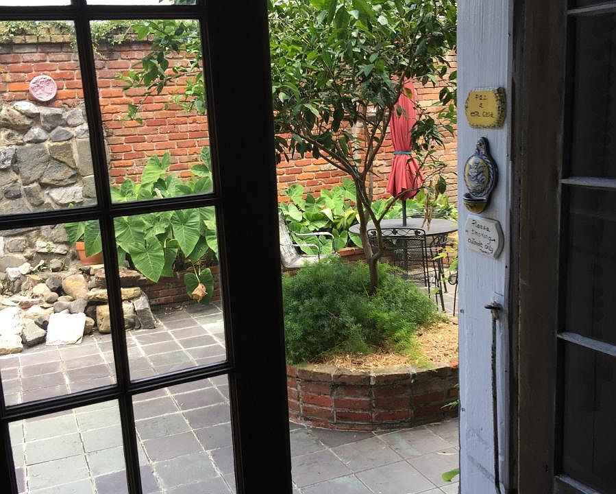 View out glass and also shuddered doors. Looking into patio