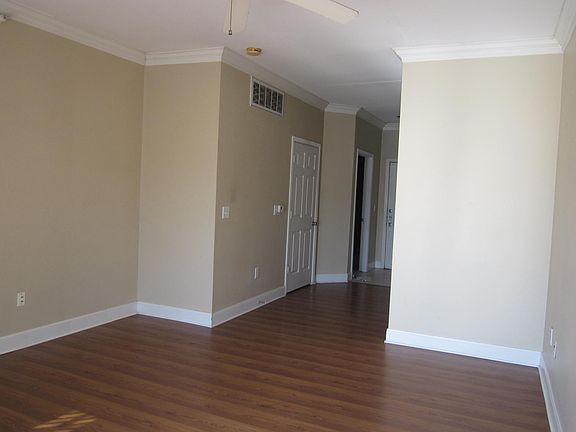 Living room looking toward hall to bedroom, bathroom and front door
