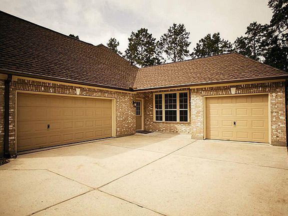 Nice parking area with two car garage and separate single car garage. Convenient door into the home.