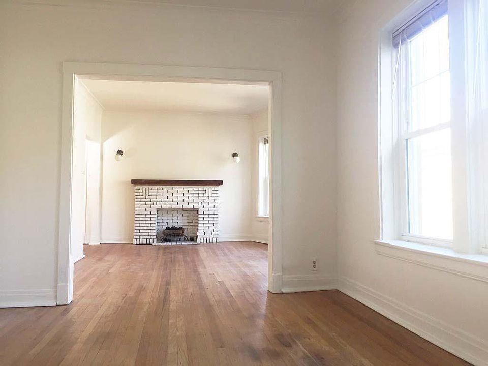 Looking from dining area to living area with decorative fire