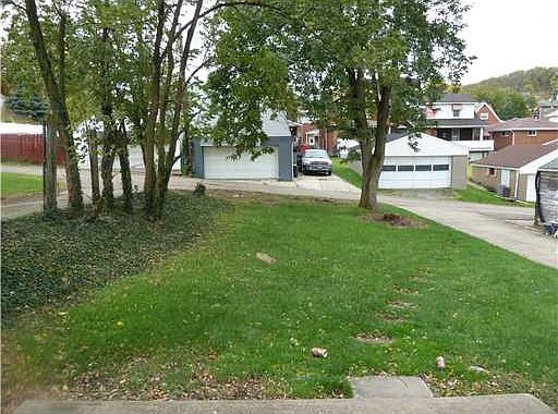 The backyard is level and adds outdoor space for you and your tenants needs