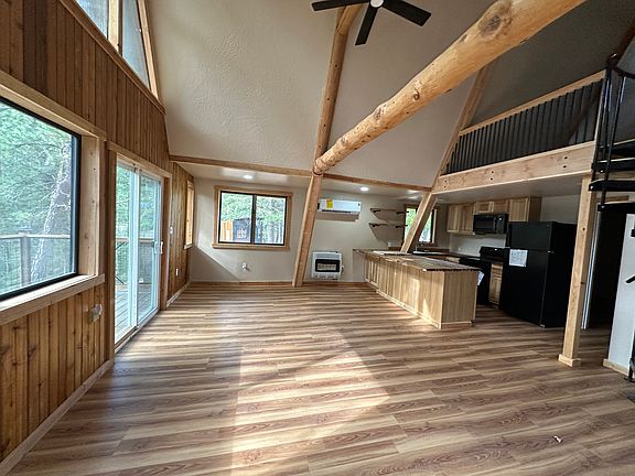 Living Room and Dining Area. Sliders out to deck.