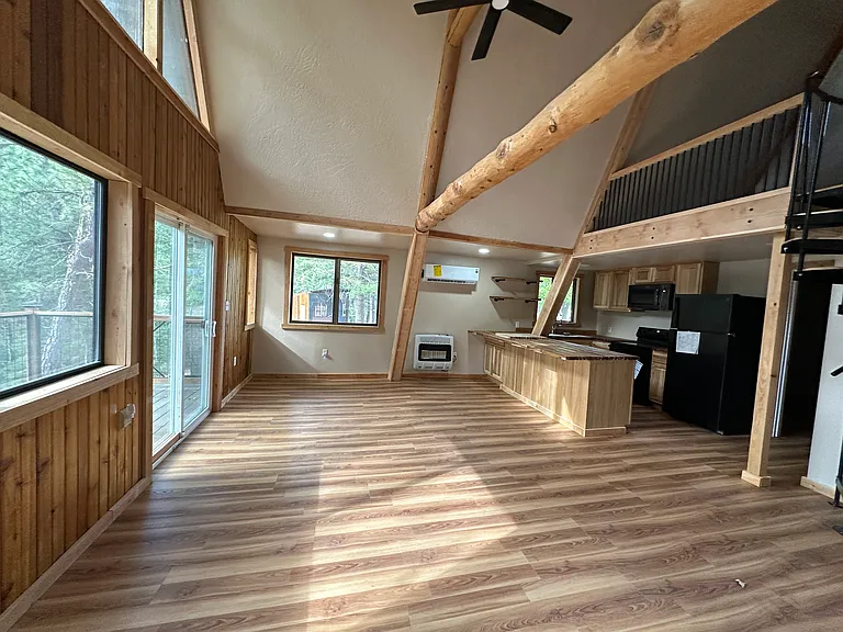 Living Room and Dining Area. Sliders out to deck.