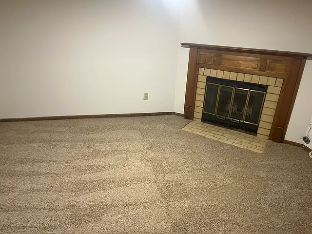 Finished basement with wood burning fireplace