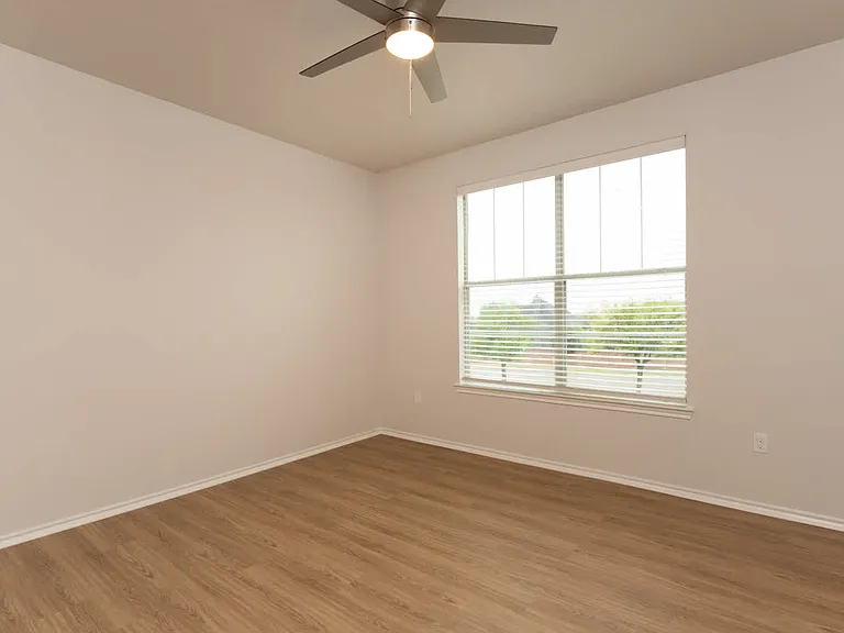 Bedroom with hard surface flooring