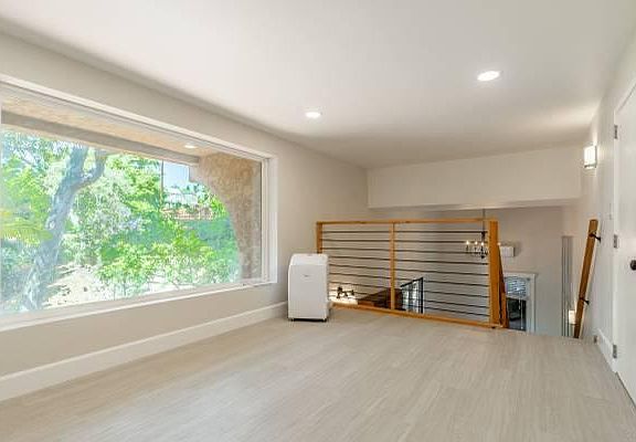Two brand new air conditioners. One wall mounted and one in the bedroom