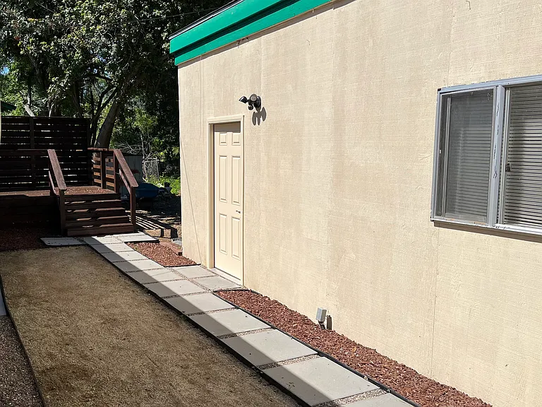 Backyard with detached storage & private deck.