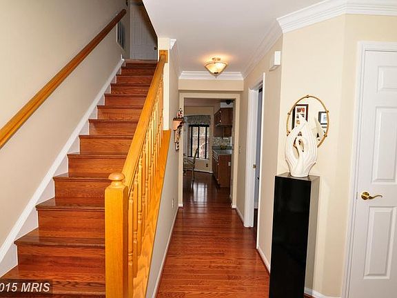 Gleaming hardwood stairs to upper level!