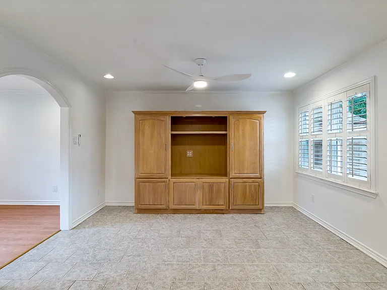 Breakfast area with built-in entertainment center and abundant light.