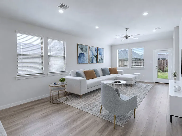 Virtually staged photo of the spacious and modern living room!