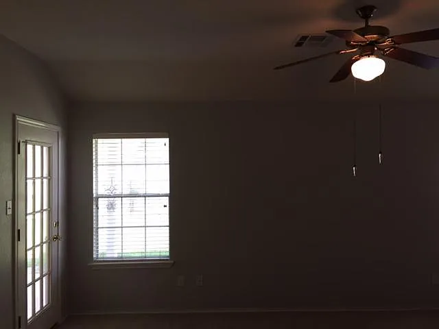master bedroom with door to backyard