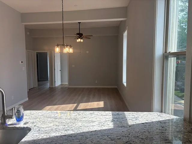 View from Kitchen across dining space to living room space