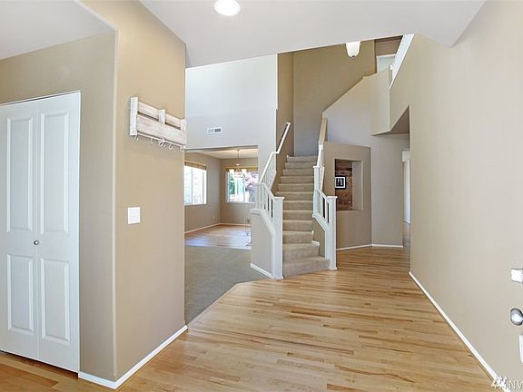 Open and comfortable floor plan, with vaulted ceilings and large living spaces.  There is room for everyone here!  Bedroom and 3/4 bath on main level, perfect for out of town guests or extended family.  