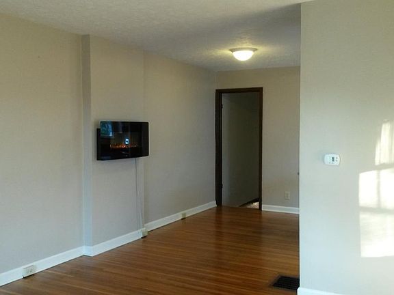Living area facing back of home with electronic fireplace