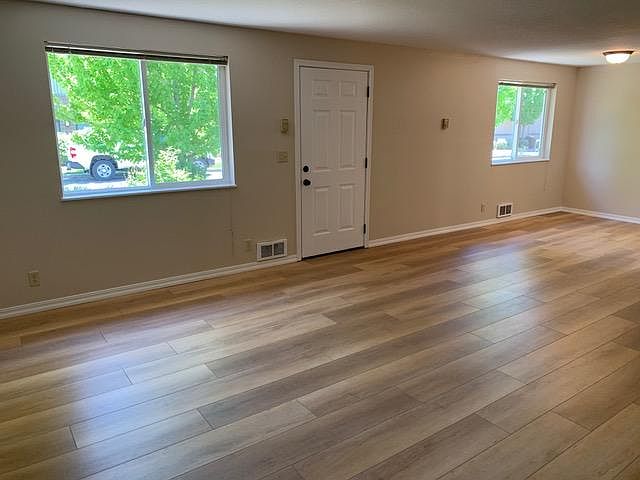 Front entry area. Handsome LVP flooring. Cadet heaters no longer used, but could function as back-up. Every window in the apartment has mini-blinds for privacy and adjustable light. All lights use LED efficient bulbs.