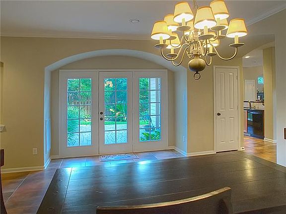 View of brick paved patio from dining room.