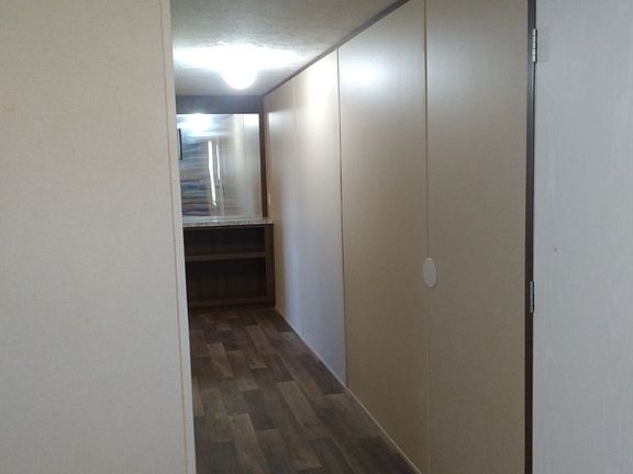 Hallway with built in shelfs