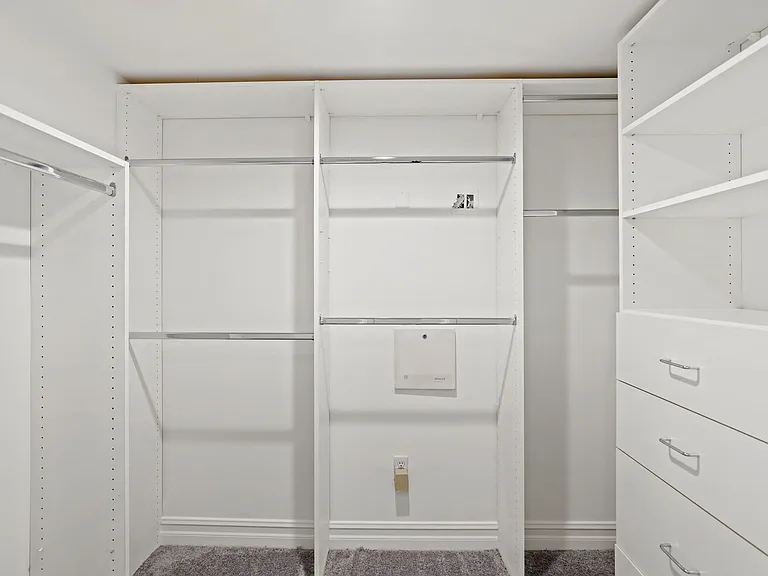 Large Walk-In Closet with Built-In Organization System