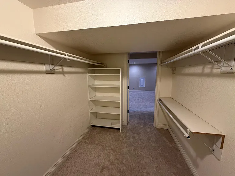 Bedroom walk in closet (one of two walk in closets in the unit)