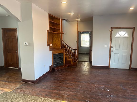 Dining/desk area left, living room, front door right