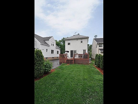 Landscaped Backyard with Wooden Deck