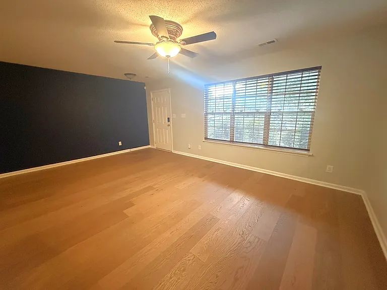 Gorgeous new wood floors adorn the main living areas.
