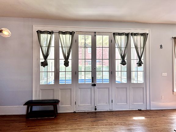 Oversized backdoors opening onto the screened porch