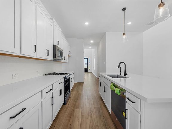 Kitchen. Sample product photo. Actual exterior and interior selections may vary by homesite. Photo m