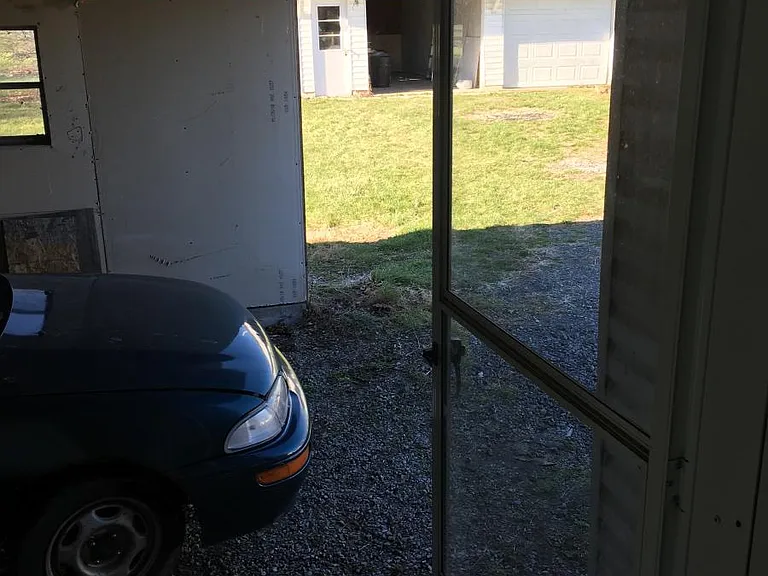 Carport...Garage in the distance