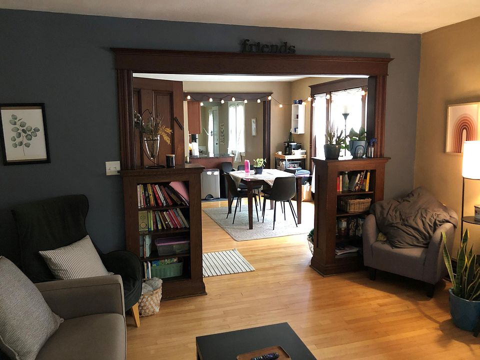 Living room has built in book cases framing the doorway.