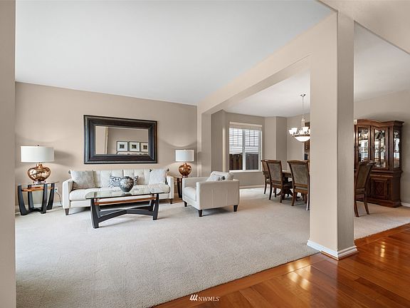 Formal living room offers another gathering place for guests with tons of natural light. 
