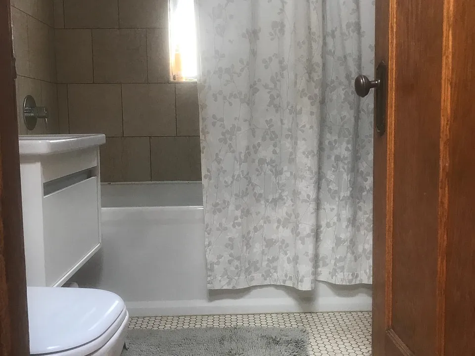 Bathroom has 6" Kohler tub. Tall closet behind door.
