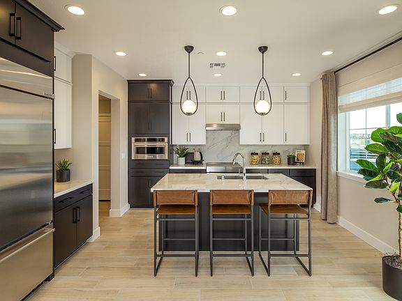 Gourmet kitchen has sink placed at the kitchen island Lots of kitchen counter space for food prepa