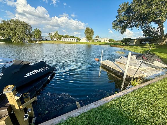 Steps into water for swimming - double jet ski dock with floating dock for your boat to park next to