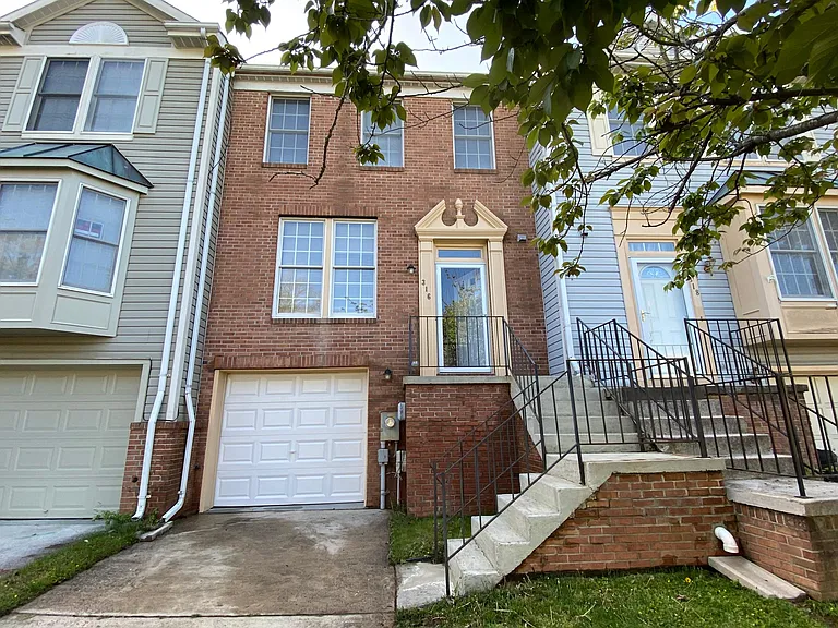 All Brick townhouse with one car garage and two car driveway