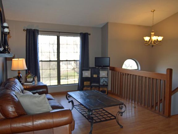 Main floor living room w/vaulted ceiling