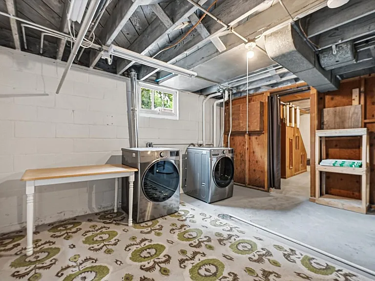 Large laundry area. Washer and dryer included. Folding table stays.