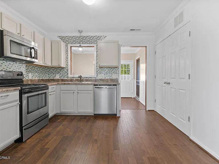 Kitchen, laundry room in double doors on right of photo.