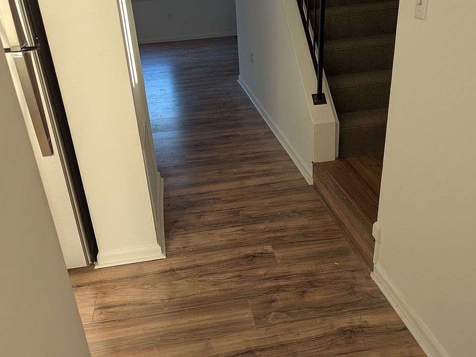 The Enterance hallway. The Kitchen is on the left, The Powder Room is to the right, and the Living/Dining room are straight ahead