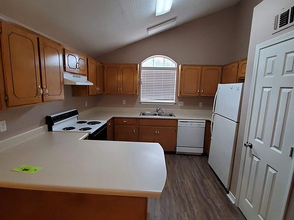 Kitchen with stove fridge and dishwasher. Plenty of room For cooking and storage with a large counter!
